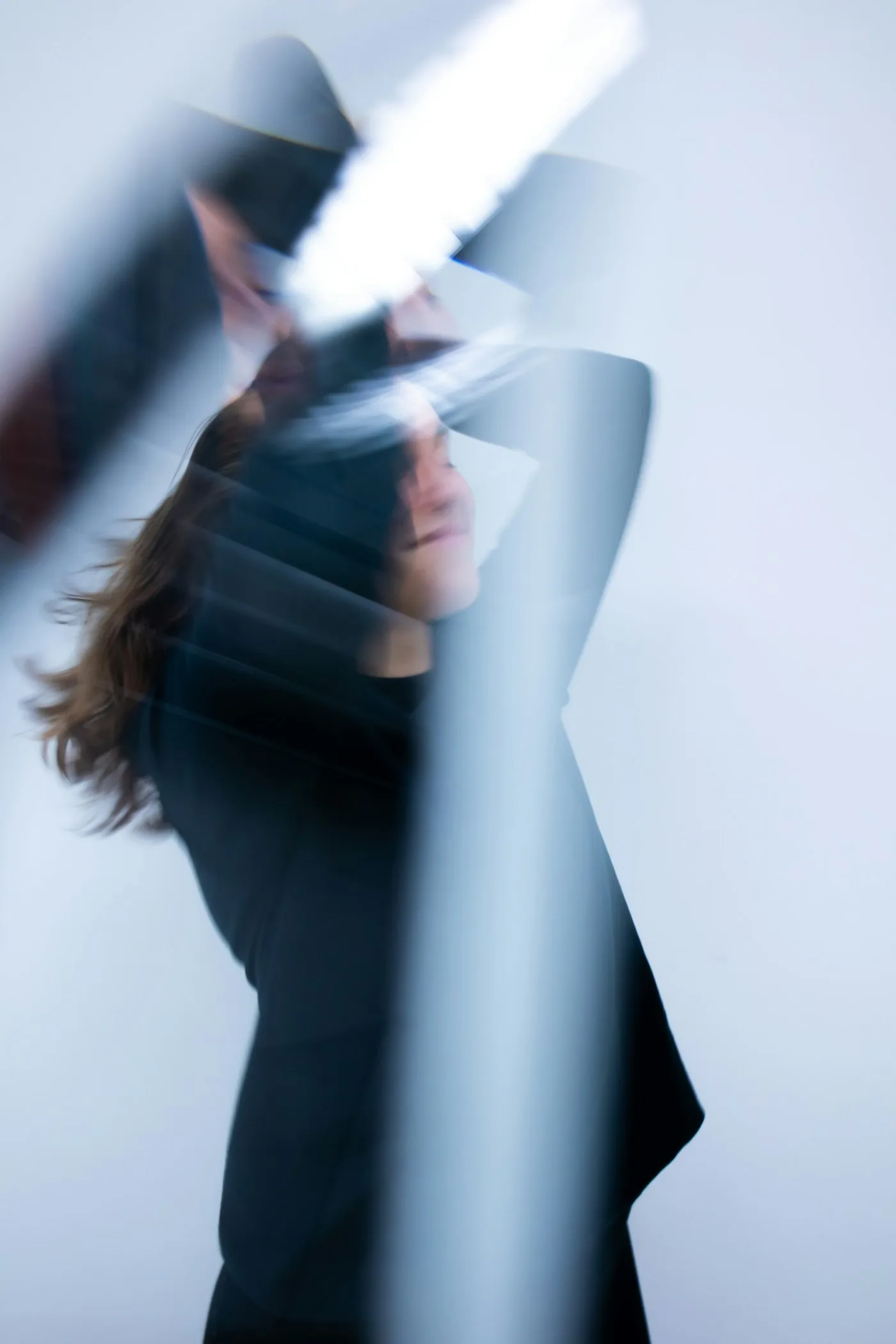 Experimental long-exposure portrait of a person in motion